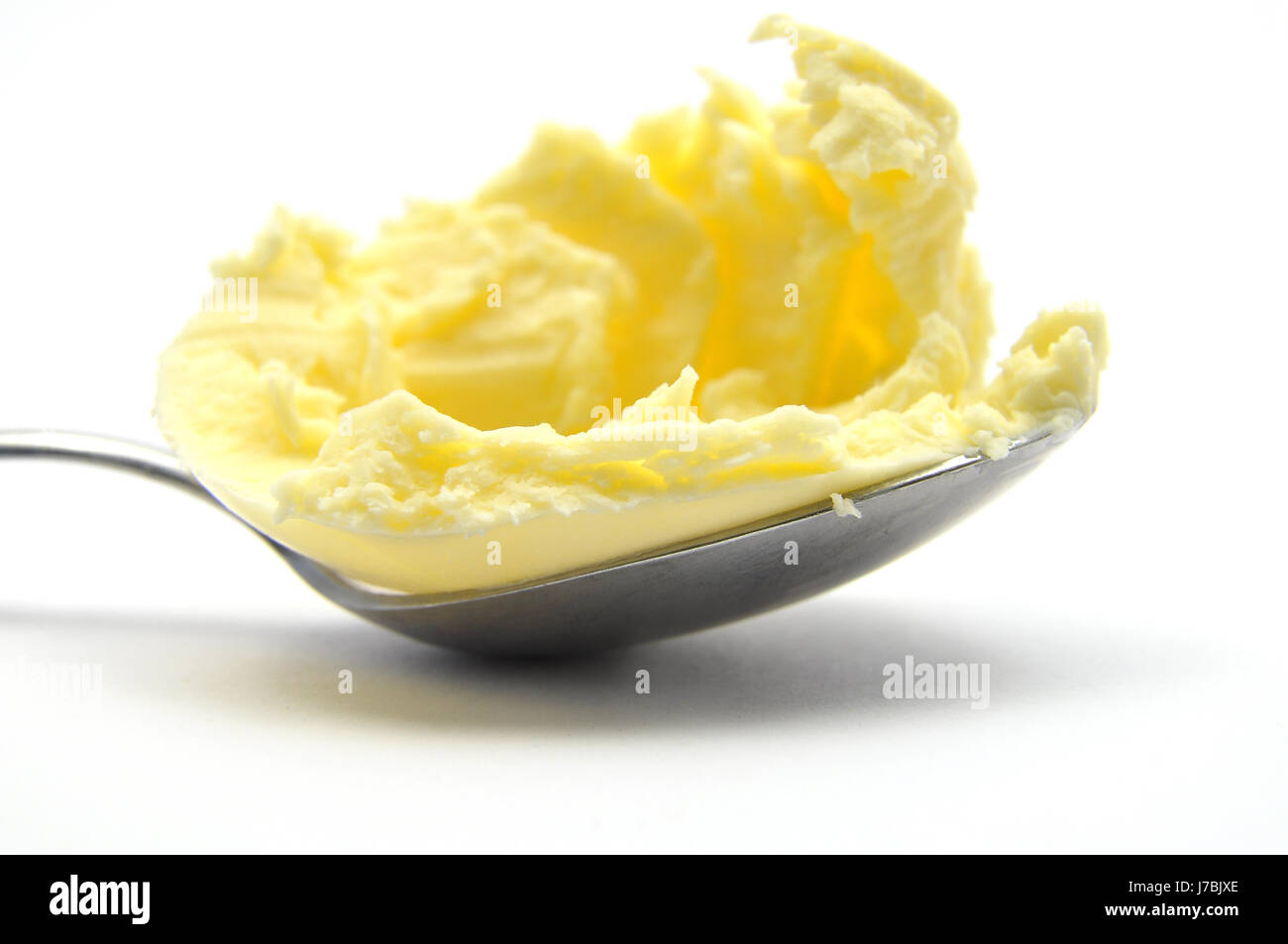 Margarine auf Löffel Stockfoto