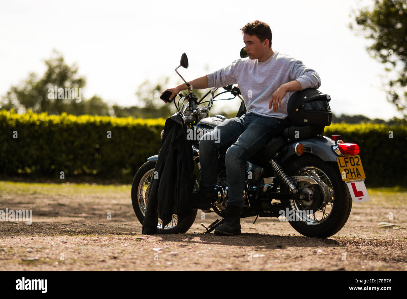 junger Mann auf einem Motorrad Stockfoto