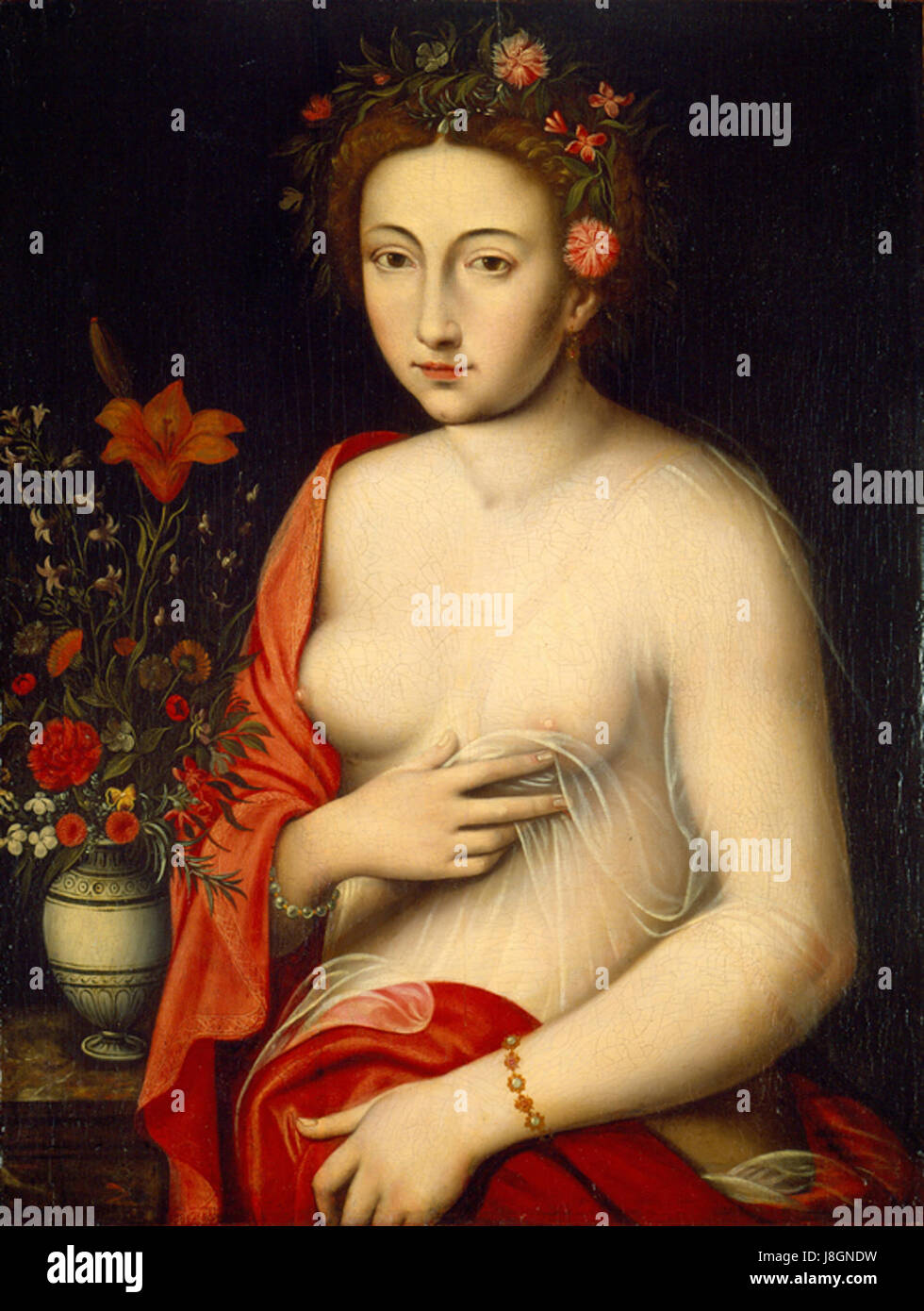 Dieses Ölgemälde aus dem 16. Jahrhundert aus der Schule von Fontainebleau zeigt eine Dame, die eine rote Lilie hält. Es ist Teil der Sammlung des High Museum of Art und zeigt Porträts aus der Renaissance und Blumensymbole. Stockfoto