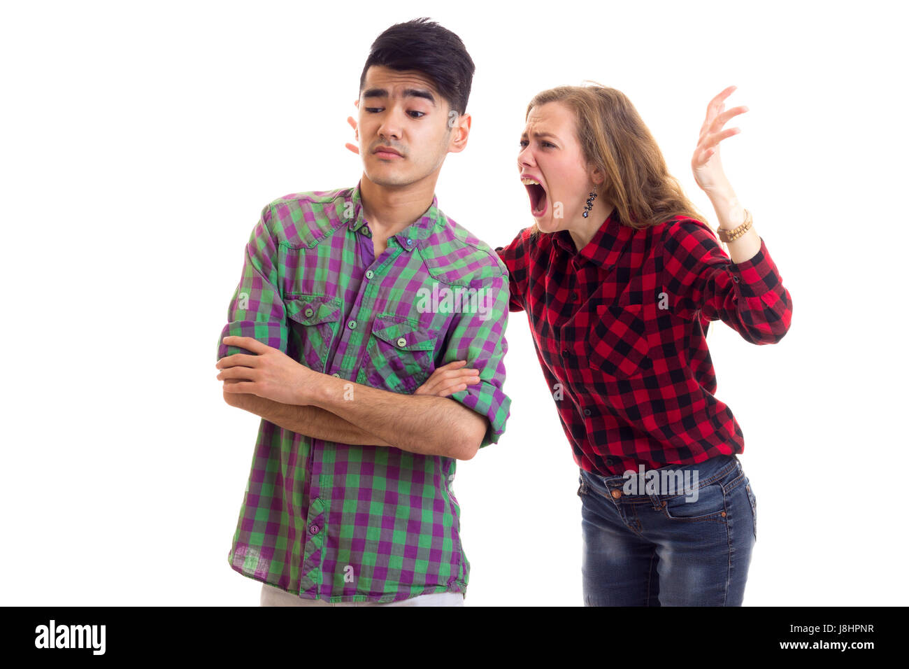 Junges Paar in karierten Hemden, streiten Stockfoto