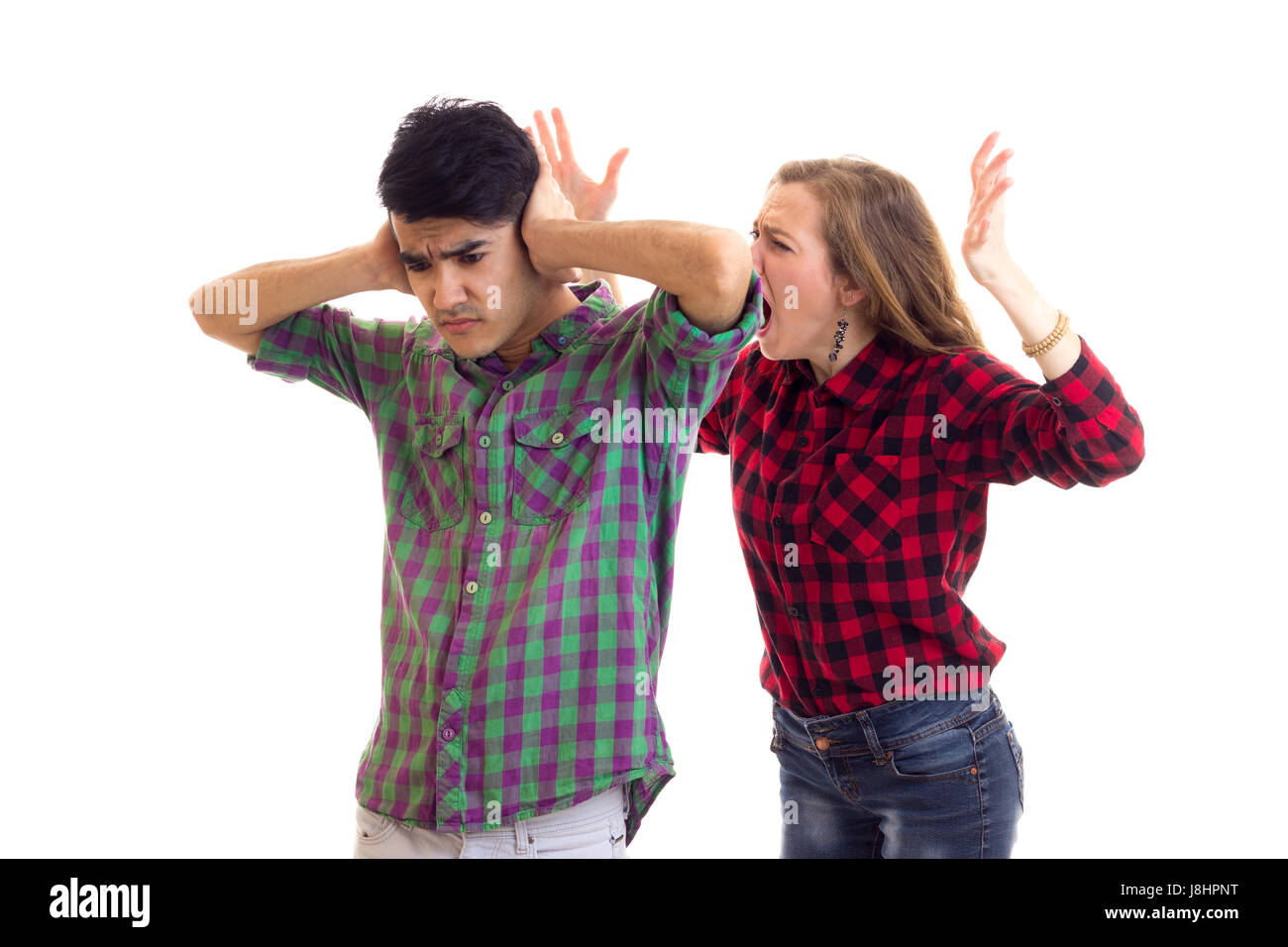 Junges Paar in karierten Hemden, streiten Stockfoto