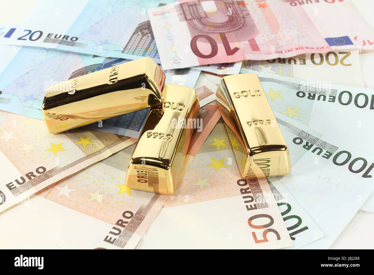 Goldbarren und euro Stockfoto
