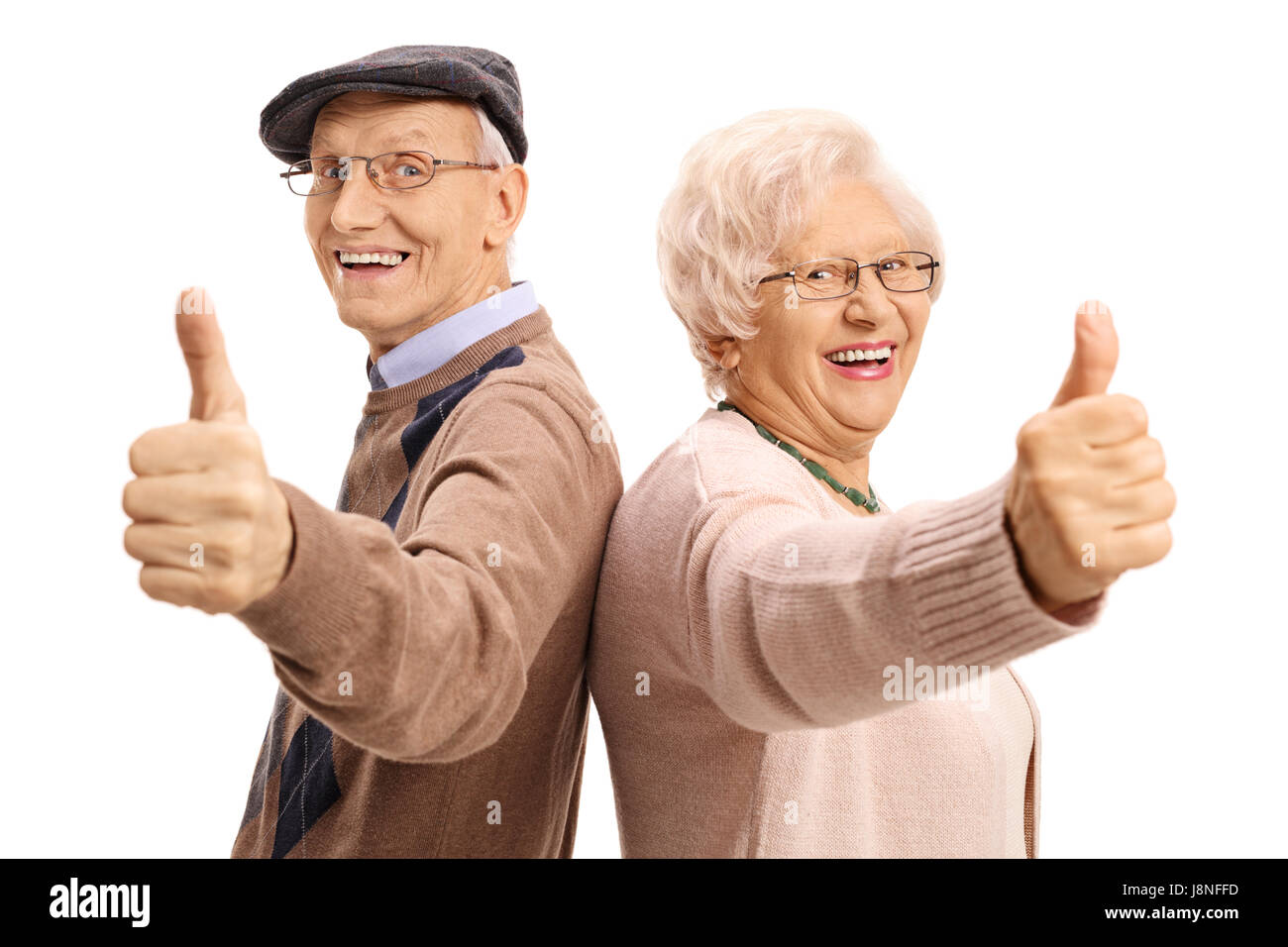 Fröhliche Senioren halten ihre Daumen hoch isoliert auf weißem ...