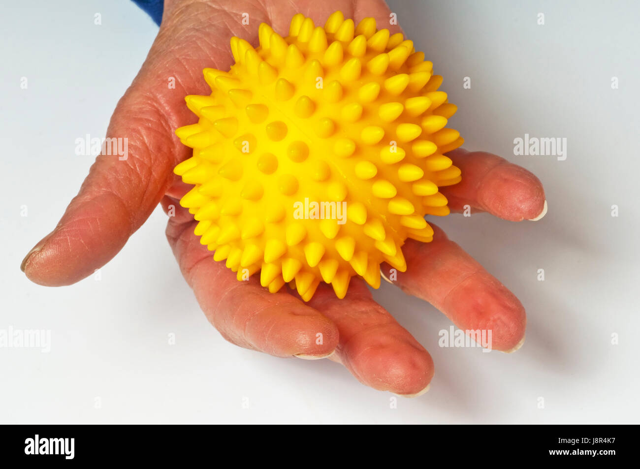 Hand mit Massage-ball Stockfoto