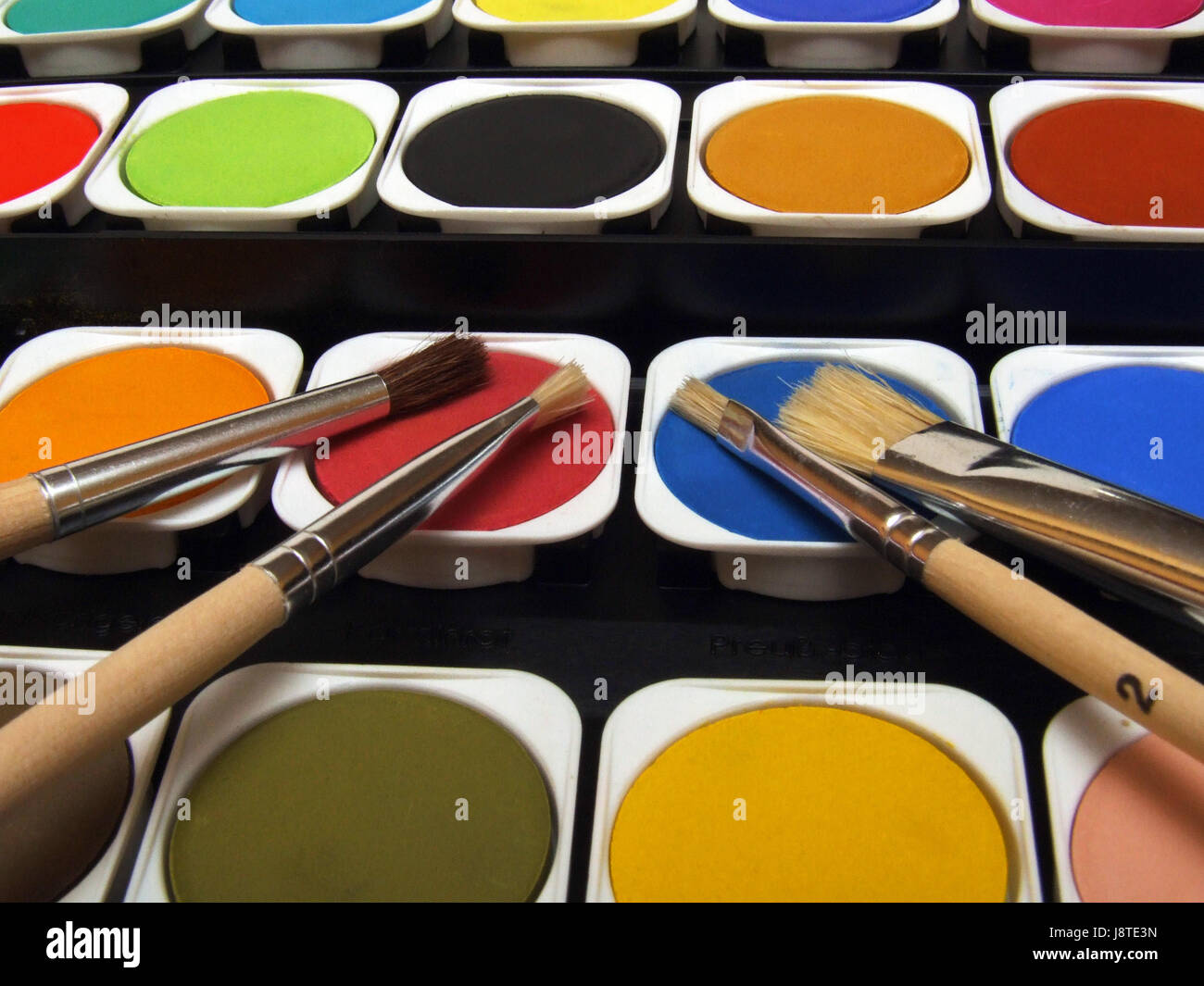 Farben und Pinsel Stockfoto