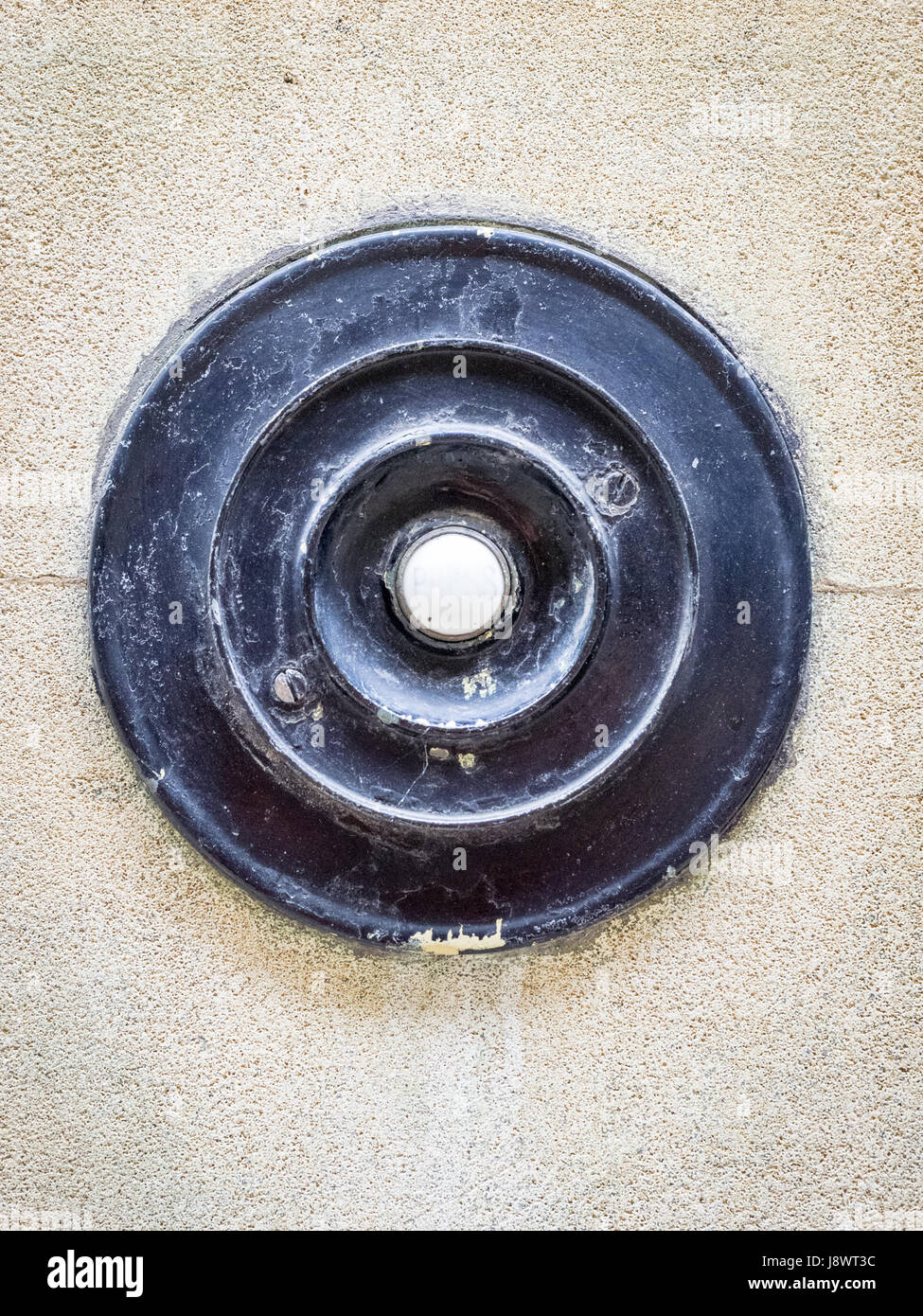 Einen altmodischen Türglocke auf einem Gebäude in Cambridge Großbritannien Stockfoto