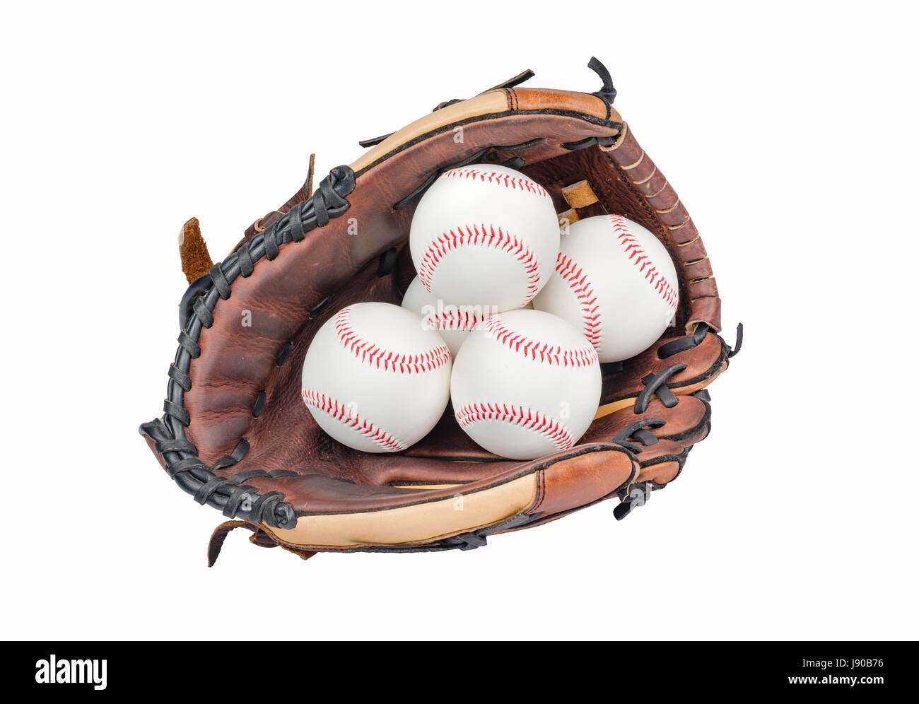 Baseball Handschuh mit vier Baseballs auf weißem Hintergrund. Stockfoto