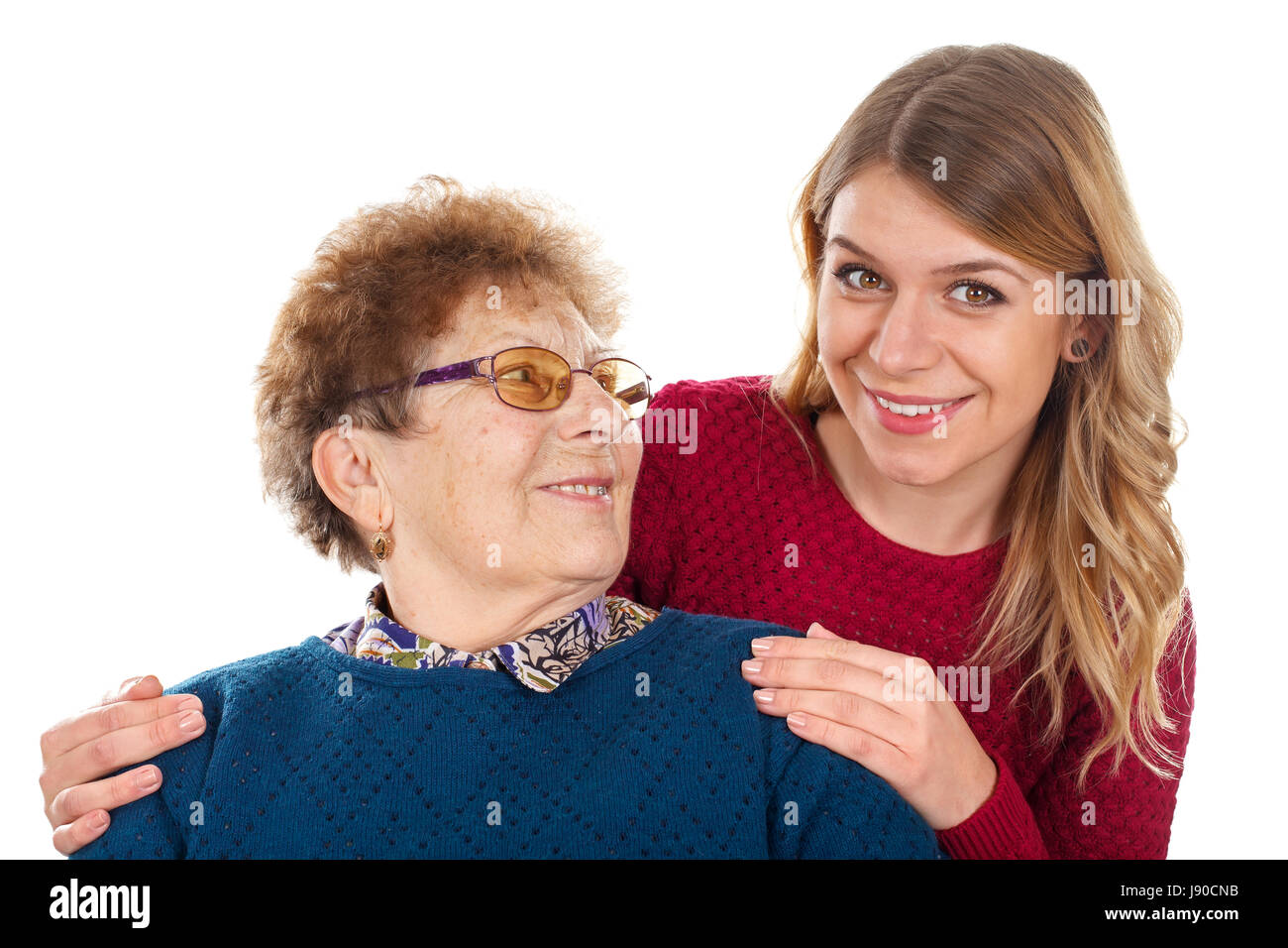 Porträt eines lächelnden jungen Frau mit ihrer Großmutter Stockfoto