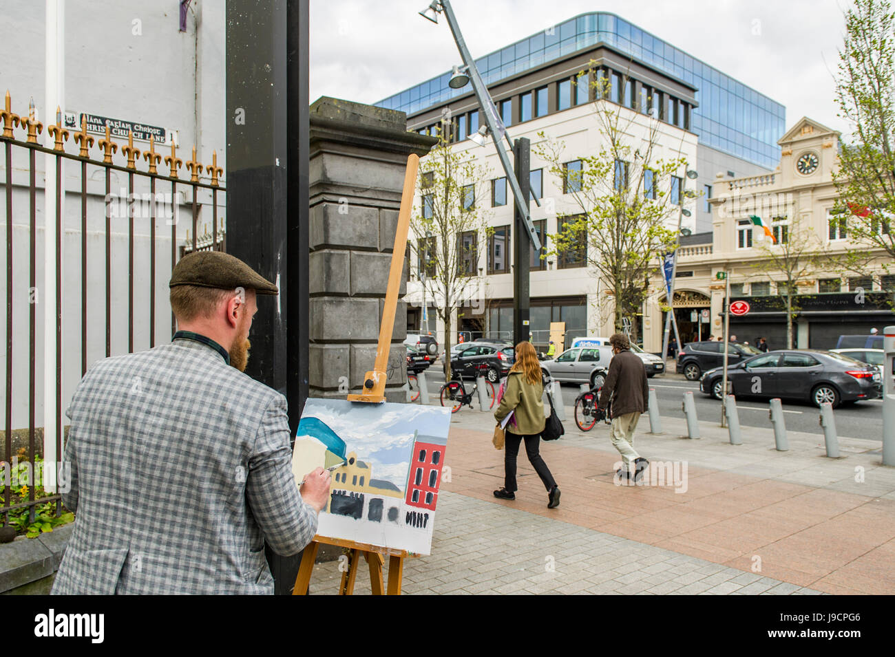 Künstler malt eine Straßenszene auf der Grand Parade, Cork, Irland mit Textfreiraum. Stockfoto
