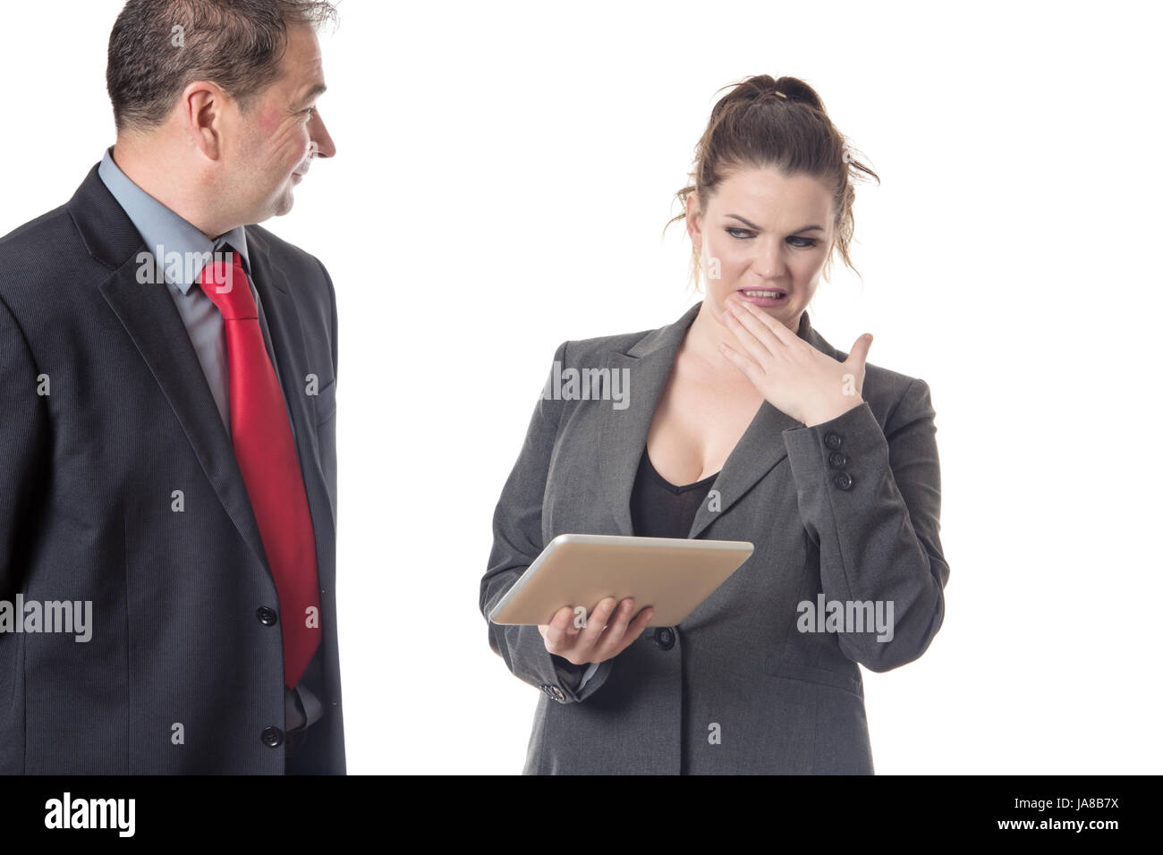 Business-Mann als abschreckend zu einer Arbeitnehmerin Stockfoto