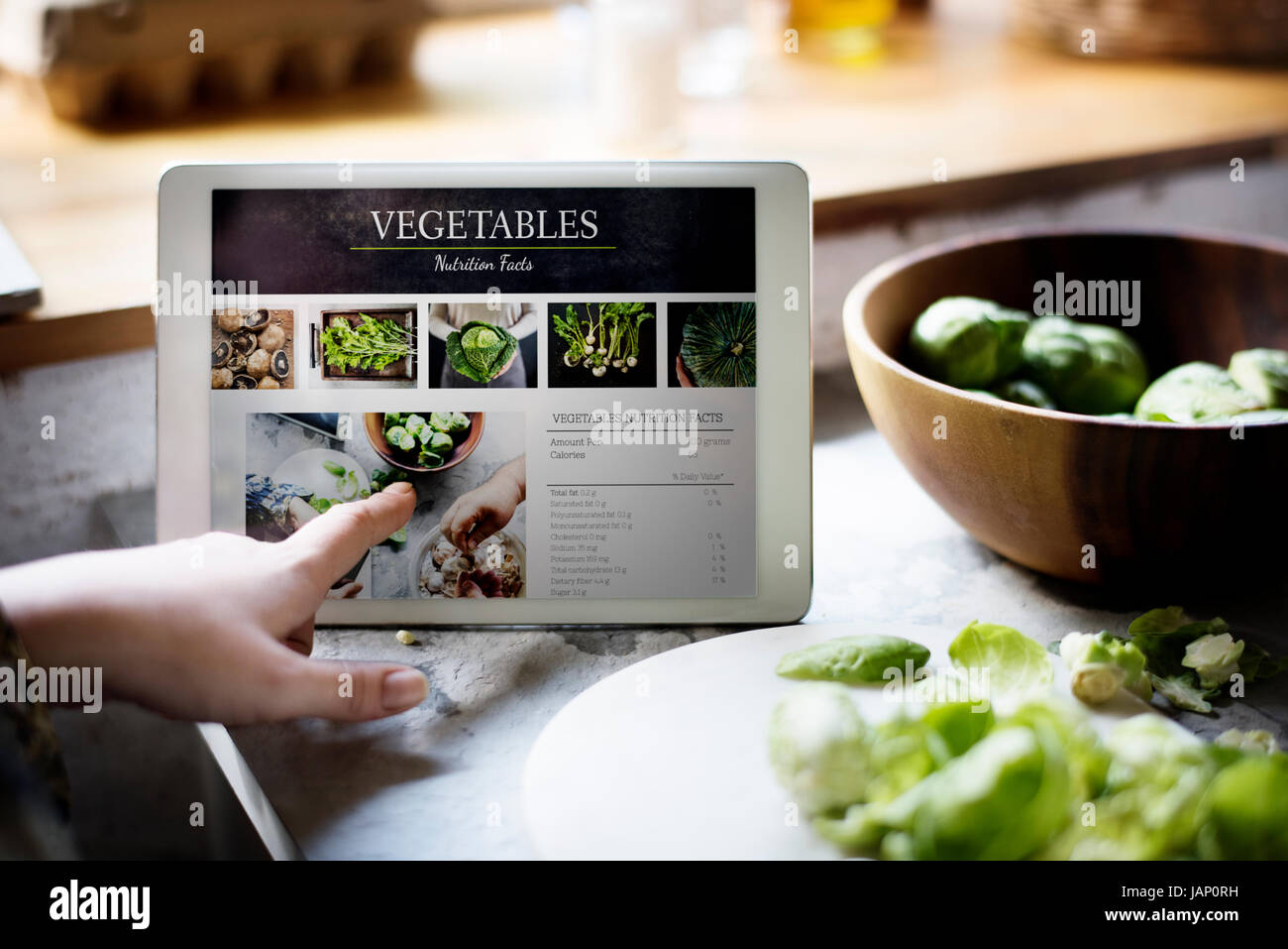 Pflanzliche Ernährung Fakten Informationen auf einem Bildschirm des Geräts Stockfoto