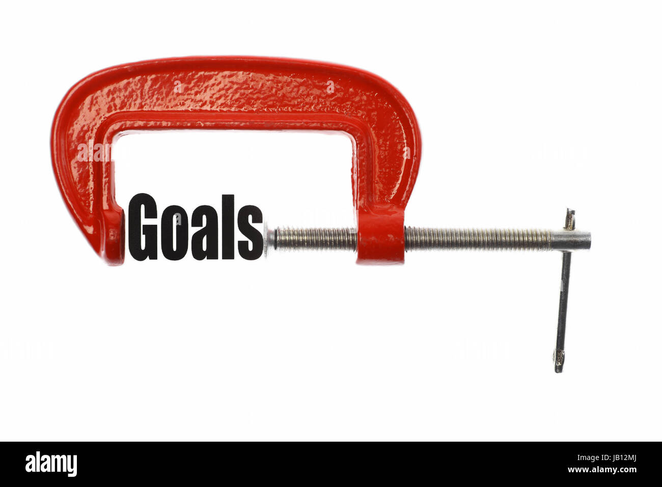 Das Wort "Ziele" wird mit einem Schraubstock zusammengedrückt. Business-Metapher. Stockfoto