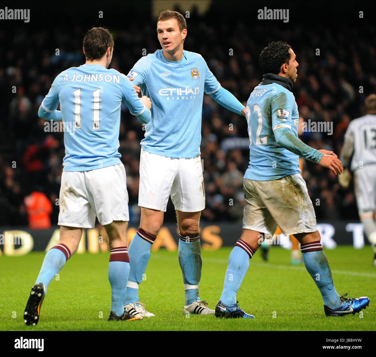 Ein JOHNSON E DZEKO C TEVEZ MANCHESTER CITY FC MANCHESTER CITY FC CITY OF MANCHESTER STADIUM MANCHESTER ENGLAND 15. Januar 2011 Stockfoto