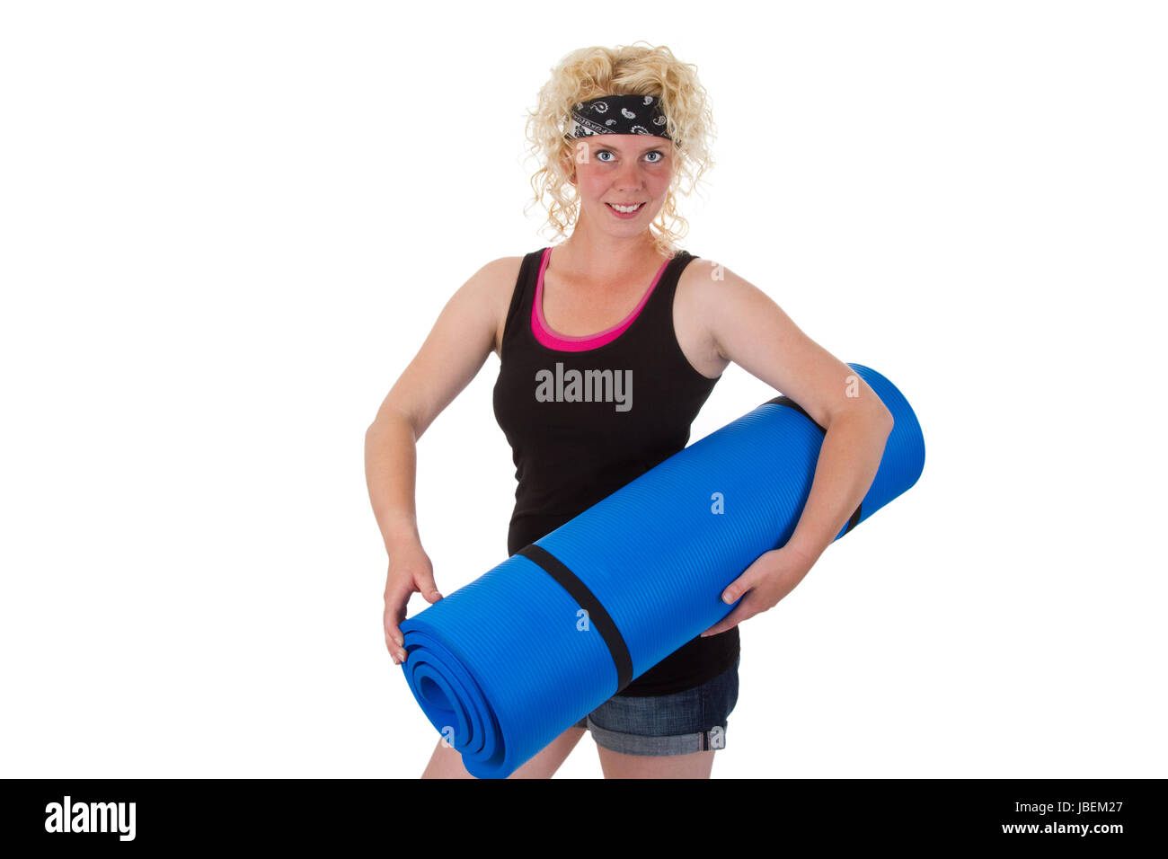 Sportliche Junge Frau Mit Gymnastikmatte - Freisteller Stockfoto