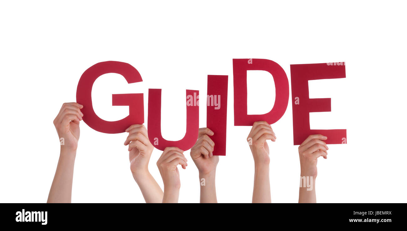 Viele Hände halten das rote Wort Guide, isoliert Stockfoto