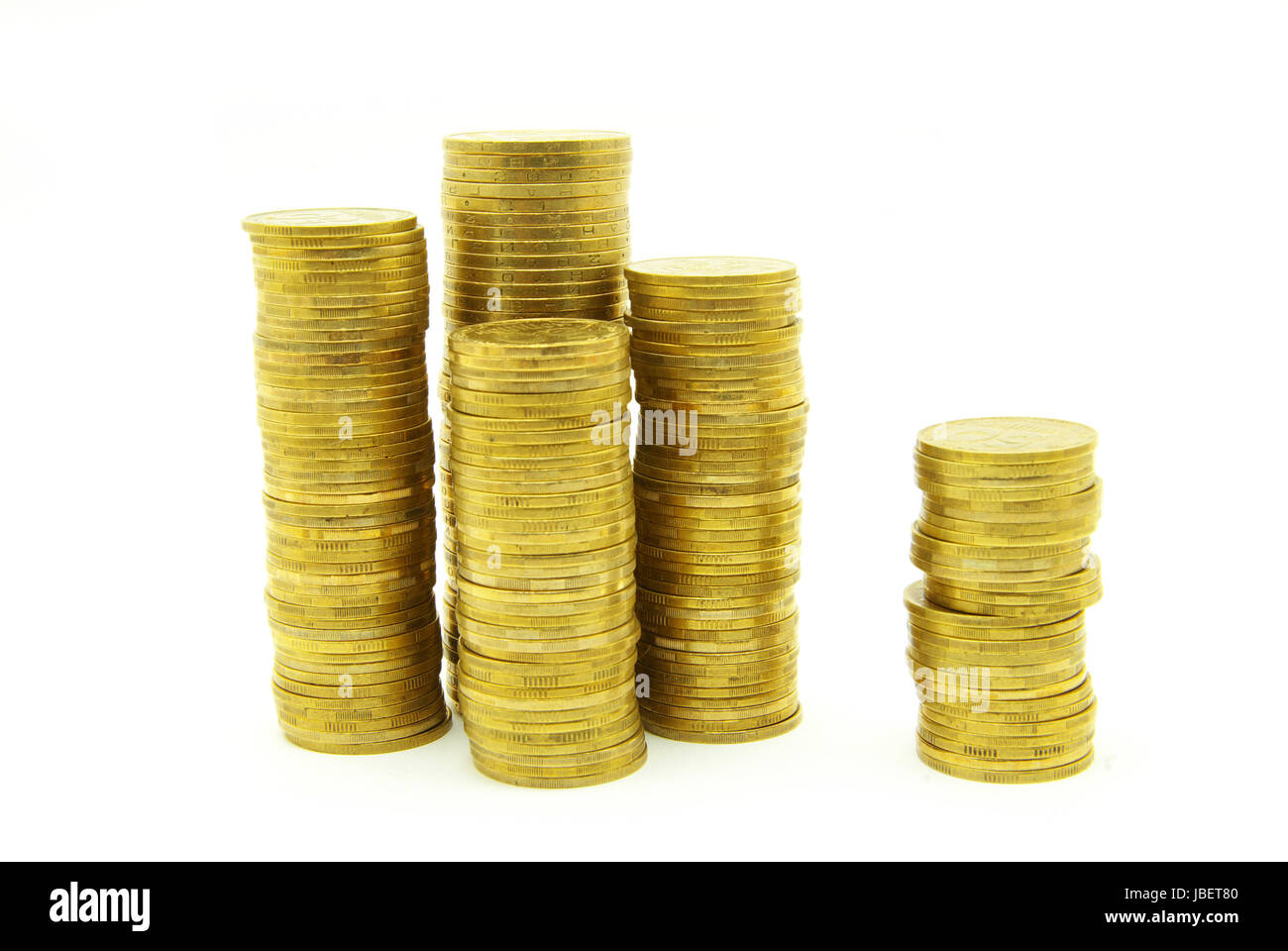Türme der Münzen isoliert auf eine weiße Stockfoto