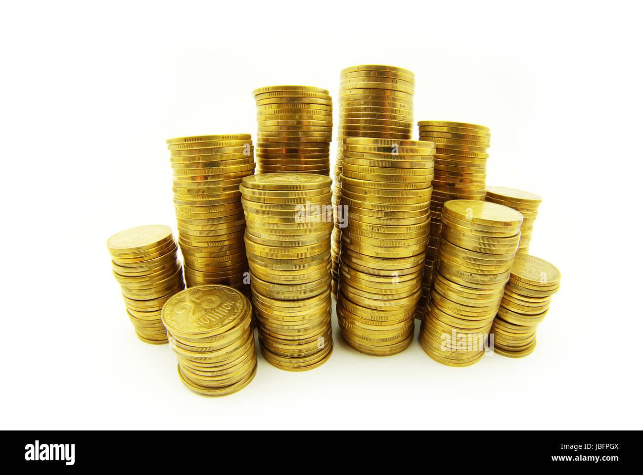 Türme der Münzen isoliert auf eine weiße Stockfoto