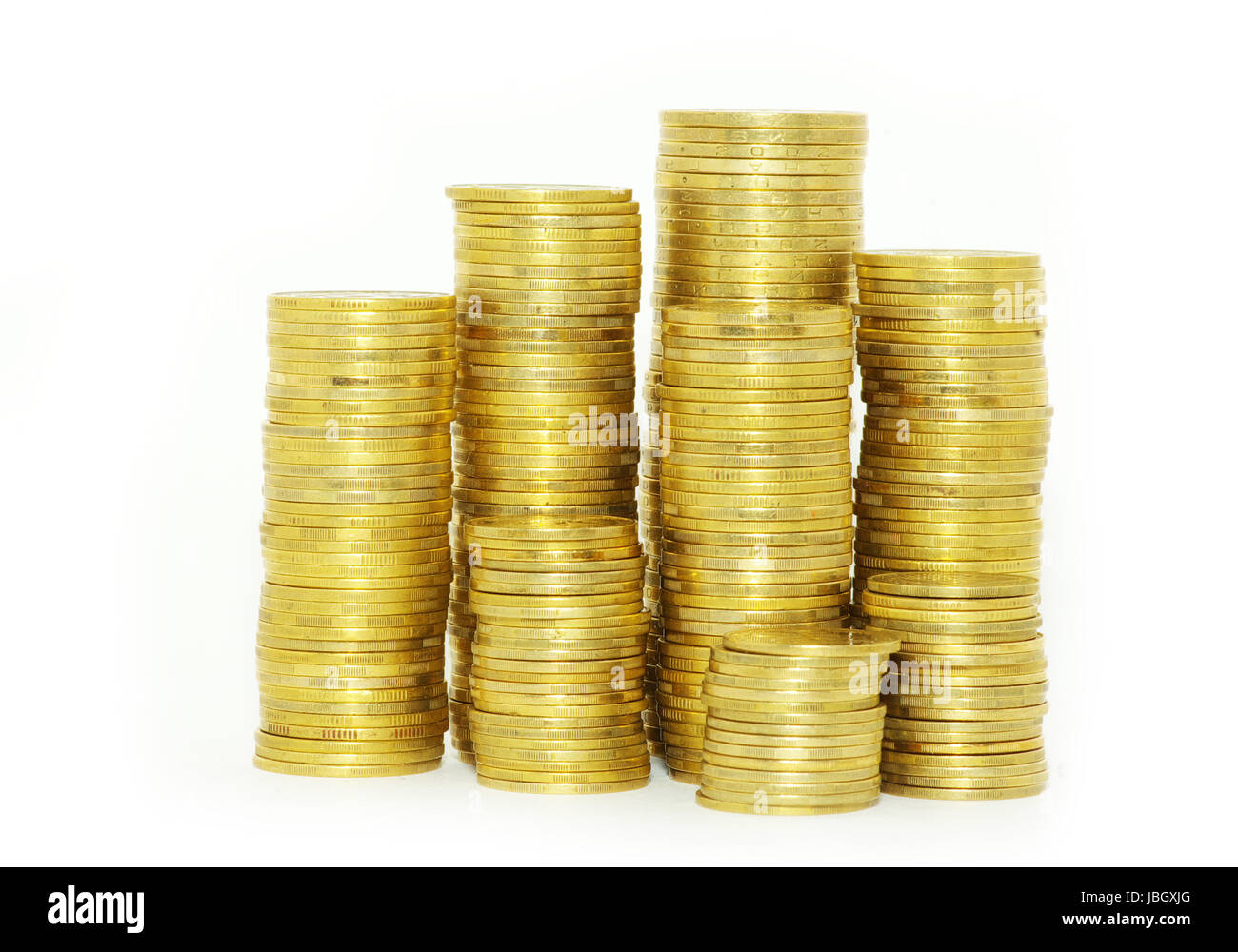 Türme der Münzen isoliert auf eine weiße Stockfoto