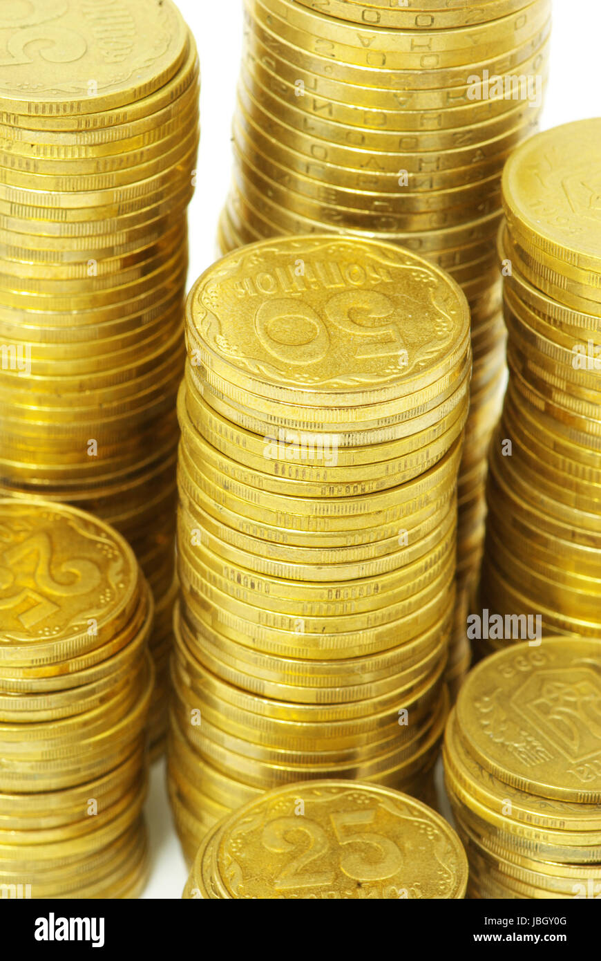 Vorrat an Münzen isoliert auf eine weiße Stockfoto