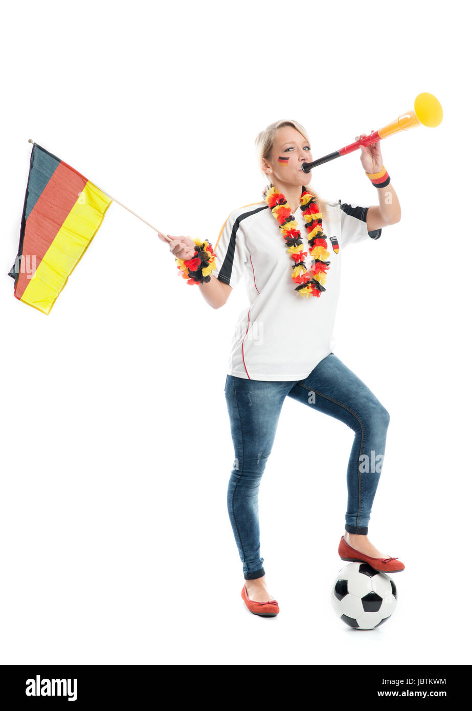 Blond Fußballfan mit Vuvuzela Stockfoto