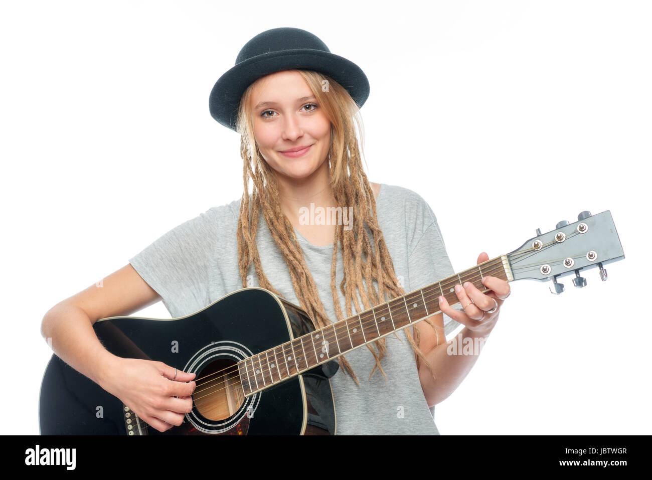 Blonde Mädchen mit Hut und Gitarre Stockfoto