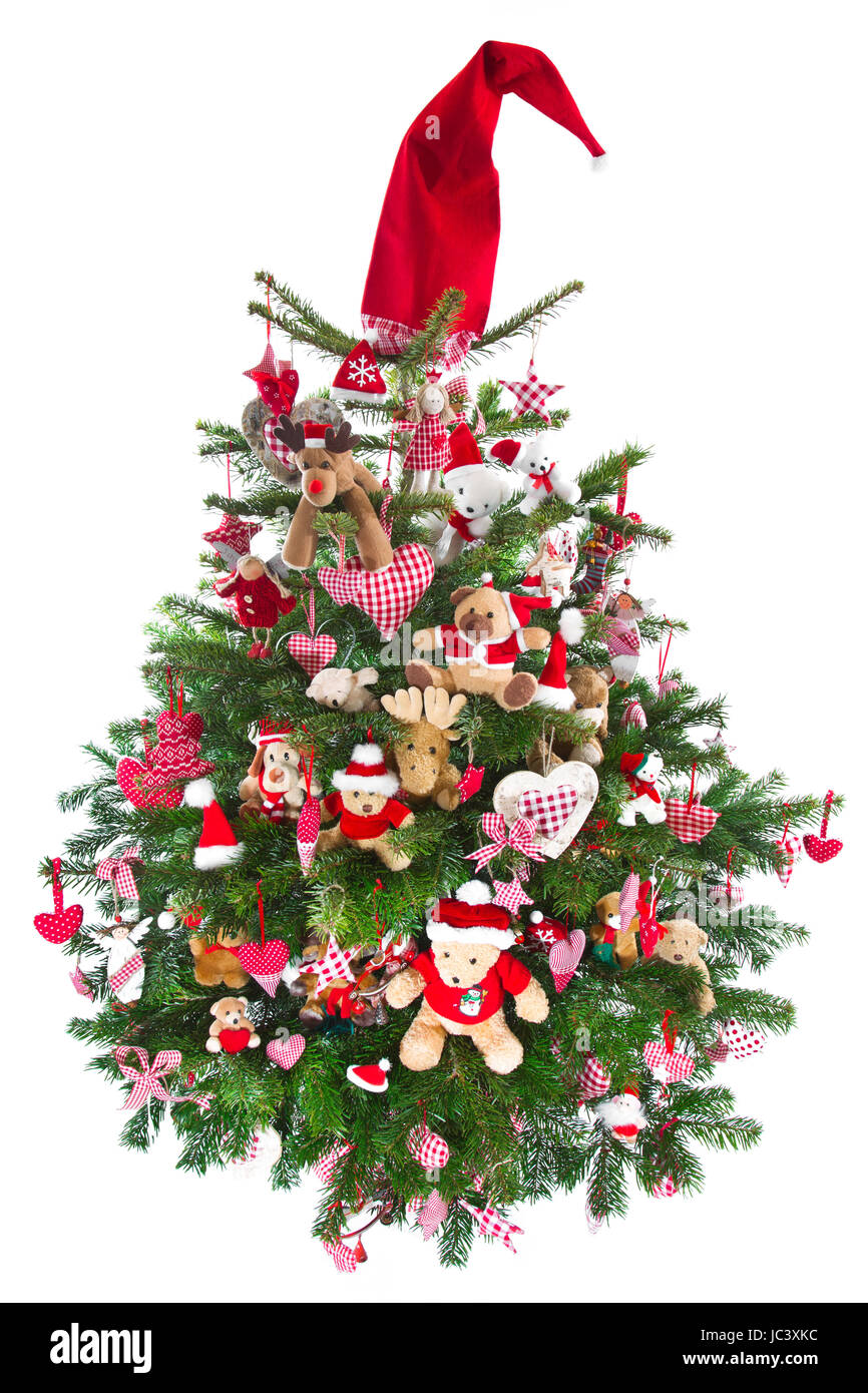 Bunt verziert isoliert Weihnachtsbaum mit roten Deko - traditionell in rot und grün mit karierten Objekte im Landhausstil Stockfoto
