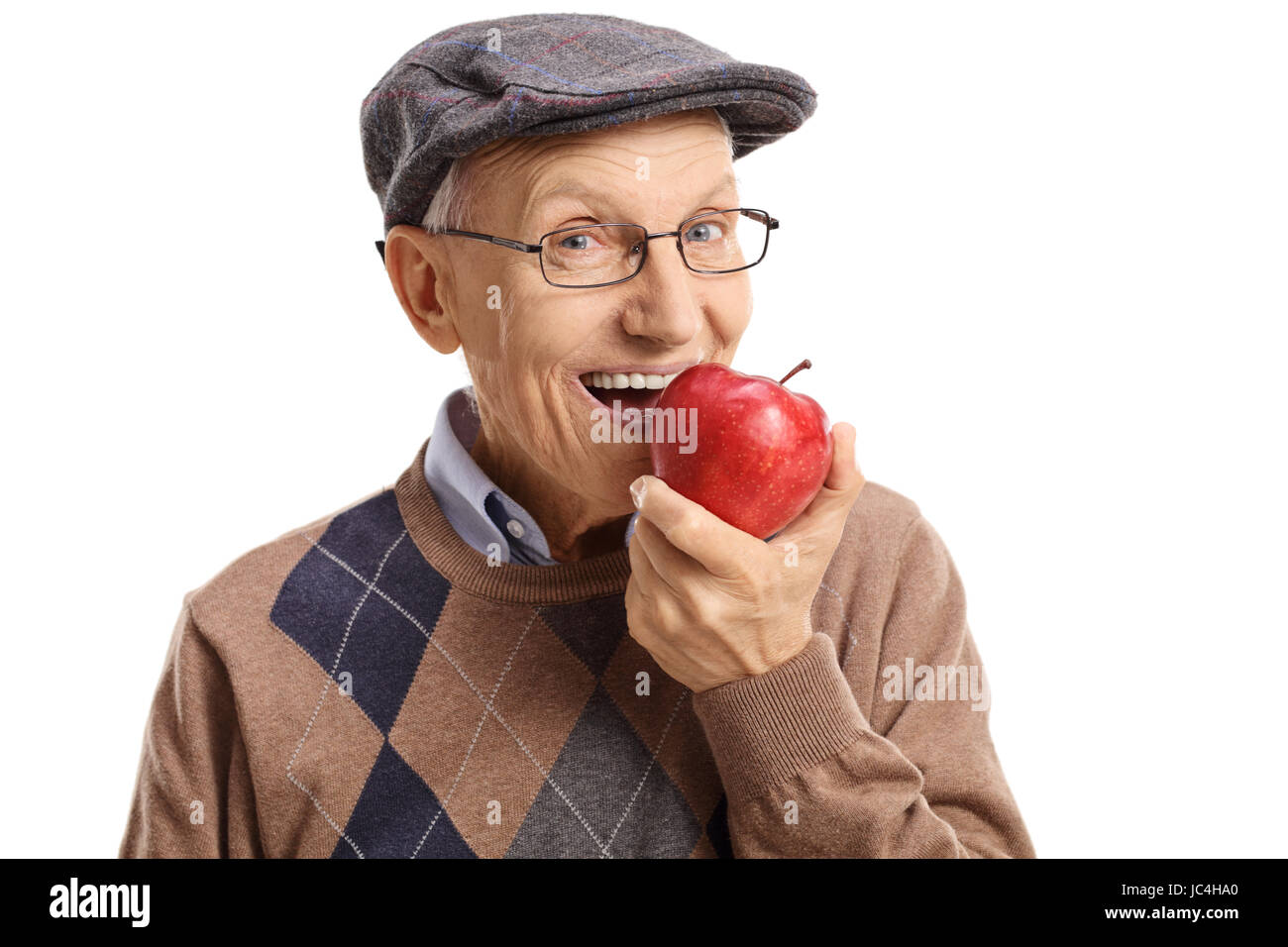 Senior mit einem Apfel, isoliert auf weißem Hintergrund Stockfoto
