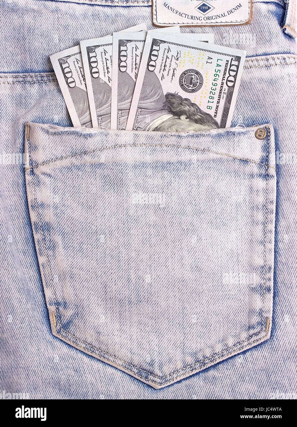 Dollar Scheine in grau Jeans Gesäßtasche Stockfoto