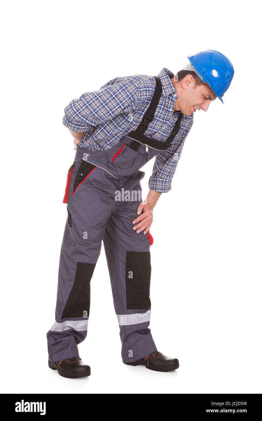 Männliche Arbeitnehmer leiden mit Schmerzen Over White Background Stockfoto