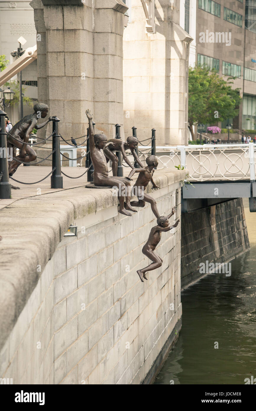 Skulptur von Kindern im Wasser springen genannt The First Generation, Singapur Stockfoto