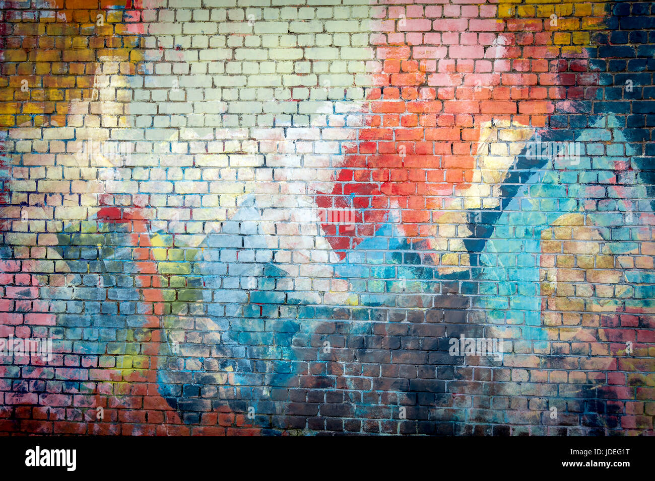 Multi farbige Graffiti bemalte Ziegel Wand Hintergrund Stockfoto
