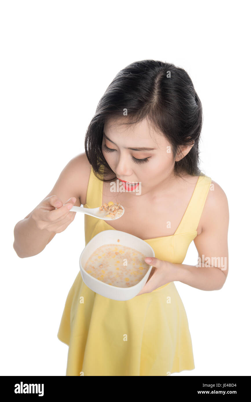 Asiatische Frau Schüssel Müsli oder Müsli zum Frühstück Essen Stockfoto