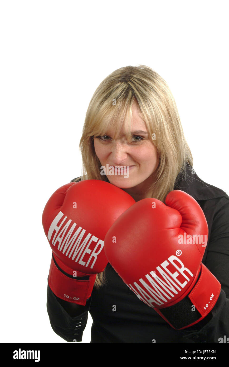 Junge Frau mit Boxhandschuhen Stockfoto