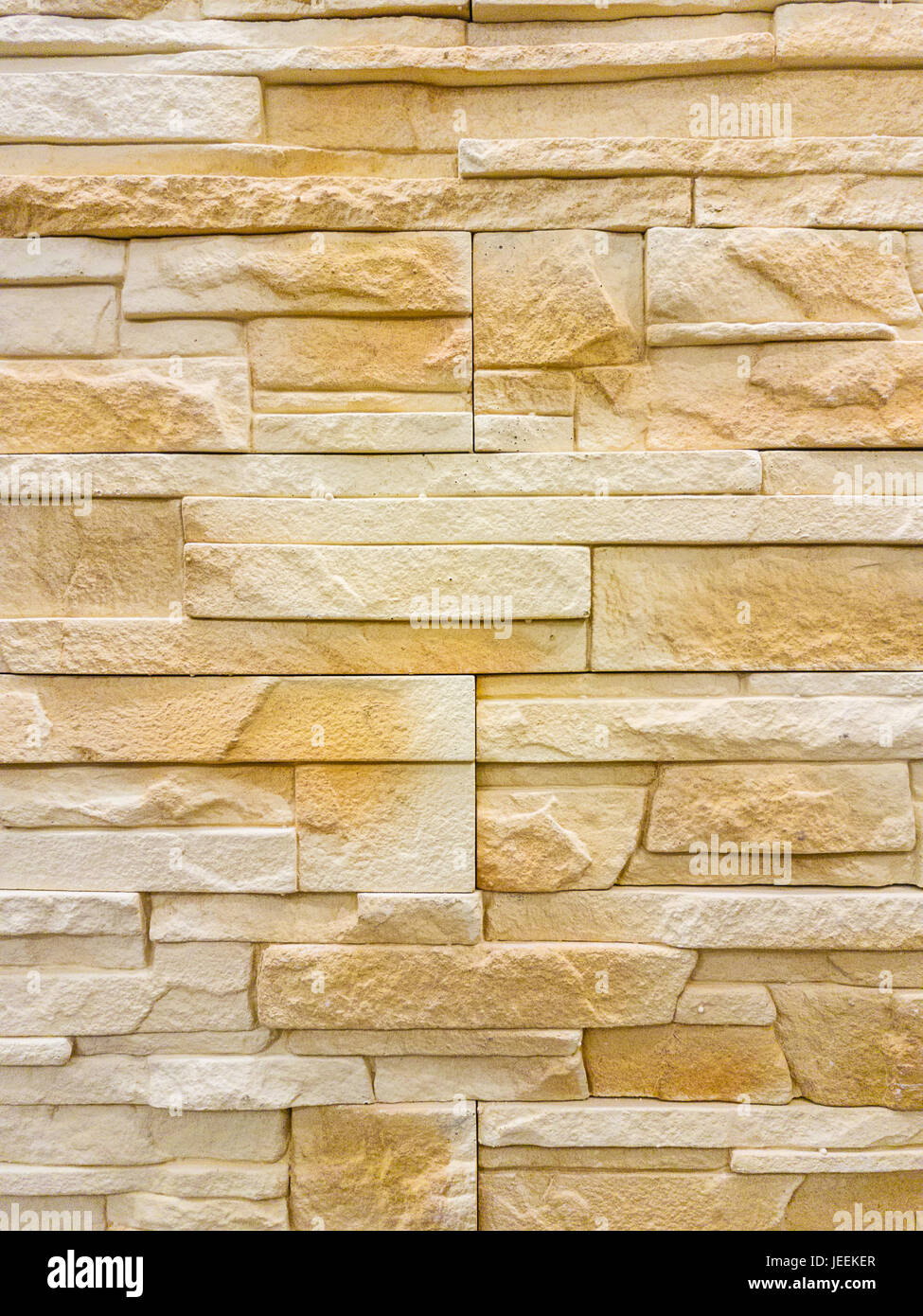 Moderne Sandstein Steinmauer Hintergrundtextur. Stockfoto