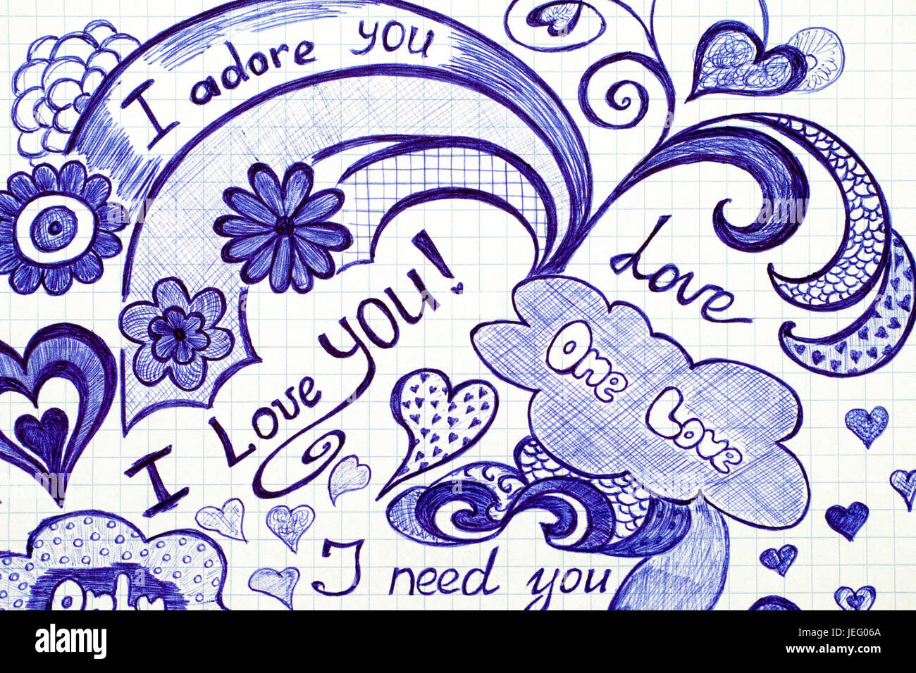 Handgezeichnete Liebe doodles Nachrichten auf kariertes Papier. Stockfoto