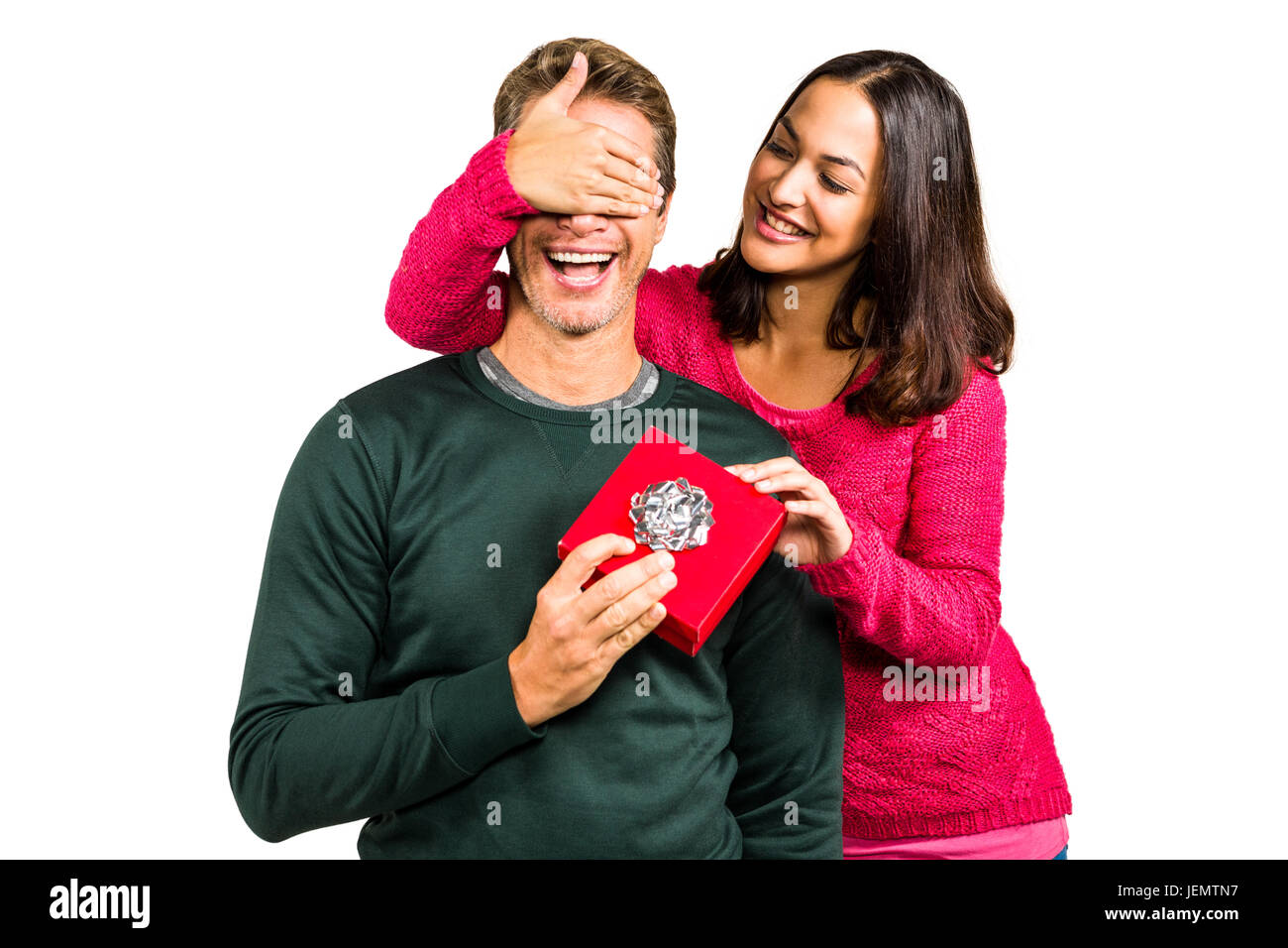 Lächelnde Freundin schließen Augen von Freund Stockfoto