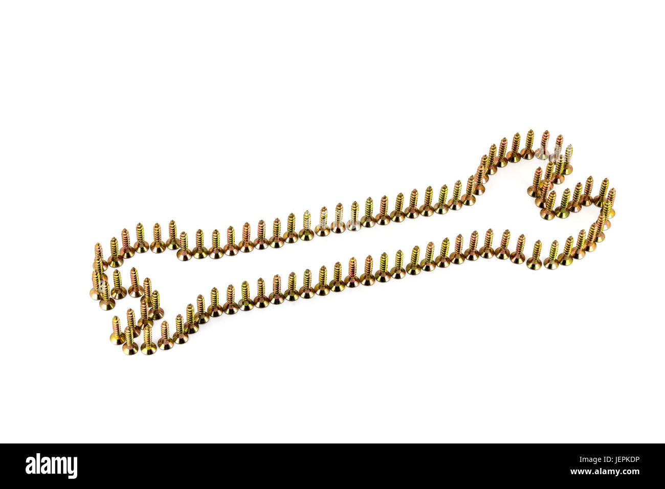 Doppelseitige Schraubenschlüssel angelegt auf weiß mit goldenen galvanisierter selbst-Anzapfungen isoliert auf weißem Hintergrund Stockfoto