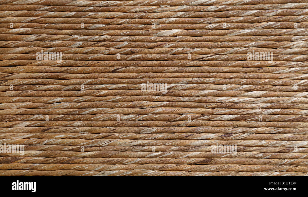 Hintergrundtextur Braun Natur Schilf oder verdrehten Stroh geflochtenen Schnur oder Bindfäden, Detail hautnah Stockfoto