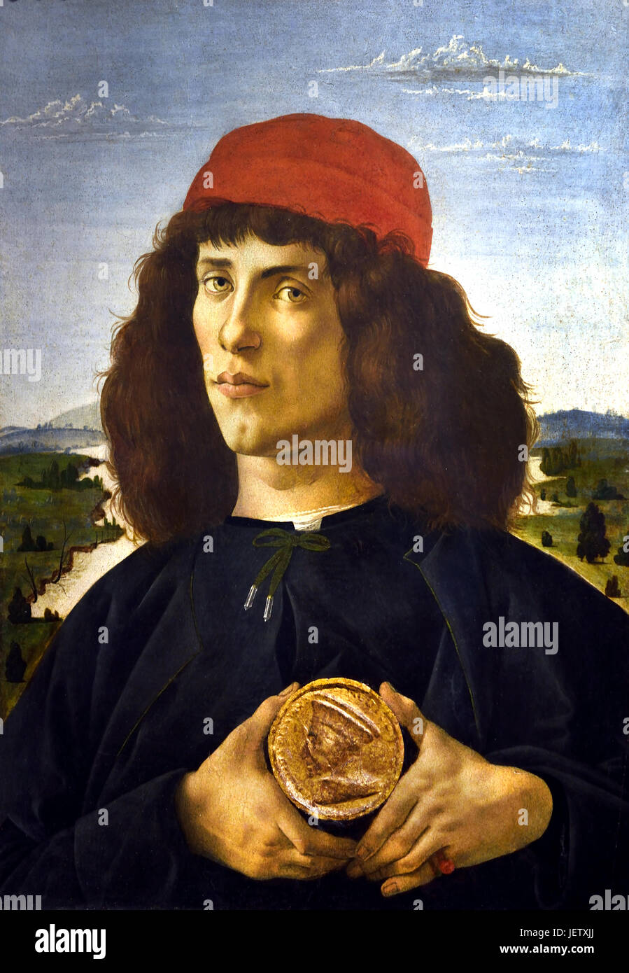 Porträt eines Mannes mit einer Medaille von Cosimo dem älteren auch bekannt als Porträt eines jungen mit einer Medaille 1475 Sandro Botticelli (Alessandro di Mariano Filipepi) 1445-1510 Florenz italienische Malerin Florentiner Schule Frührenaissance. Stockfoto