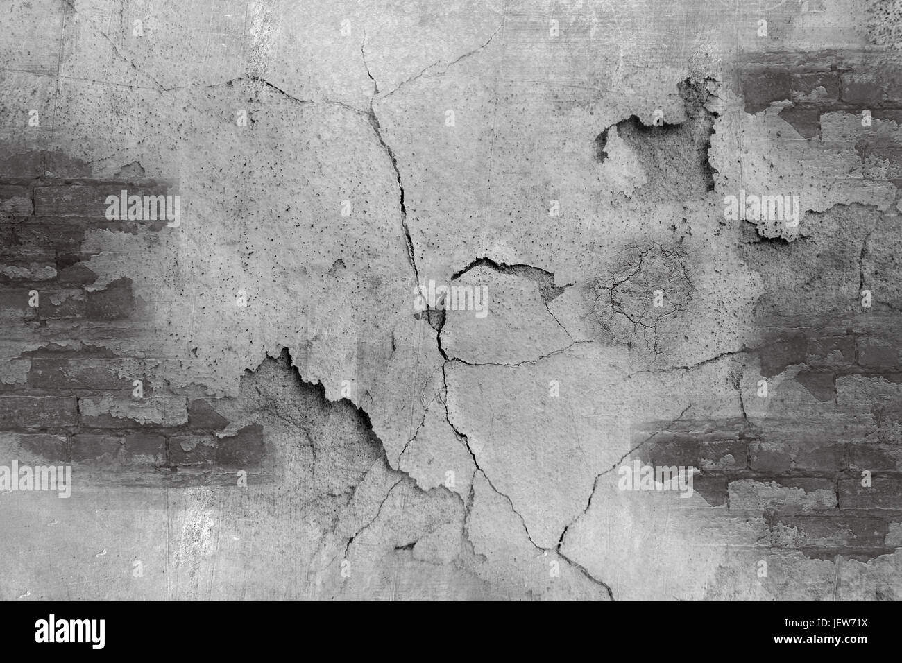 Grunge konkrete Betonmauer mit Riss im Industriebau, Stockfoto