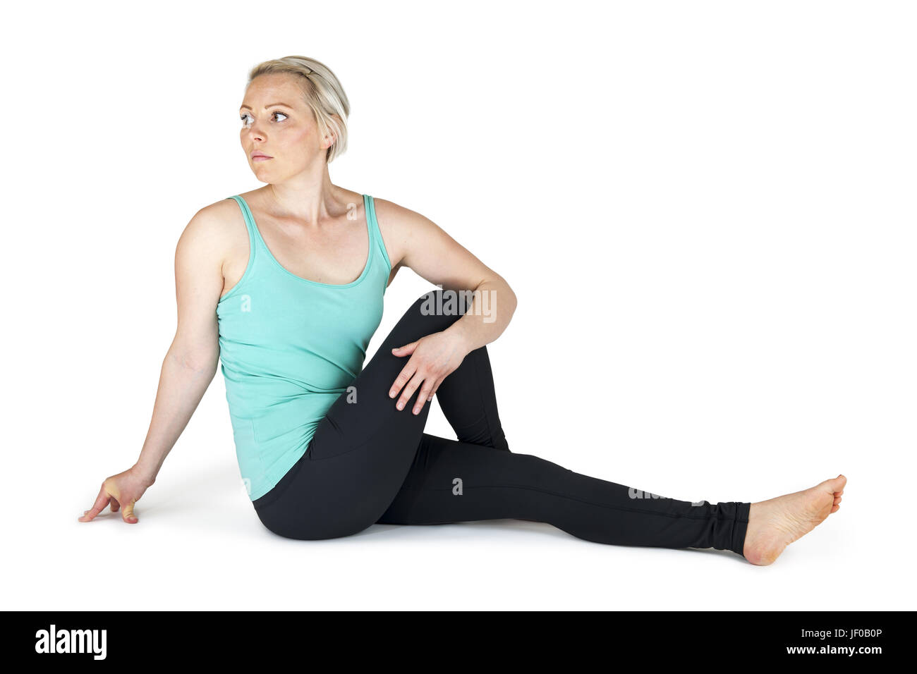 Yoga Frau grüne Position 64 Stockfoto