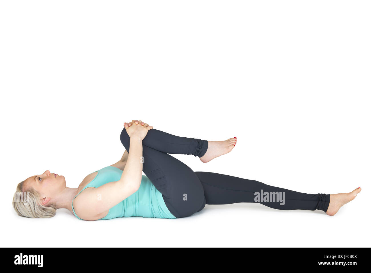 Yoga Frau grüne Position 34 Stockfoto