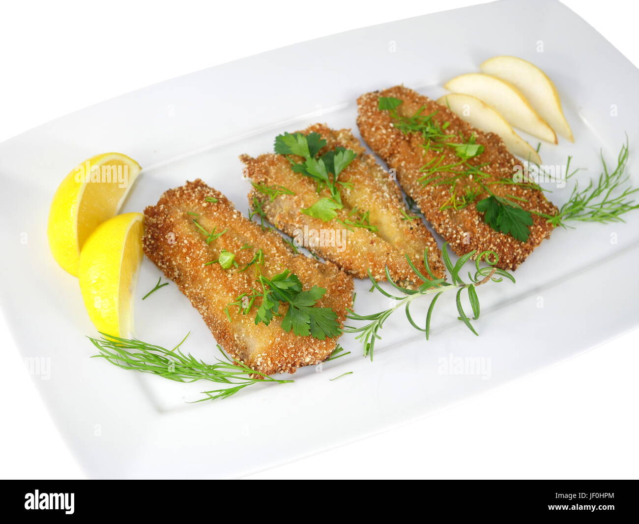 frittierte Fische Heringe mit Gemüse auf Platte Stockfoto