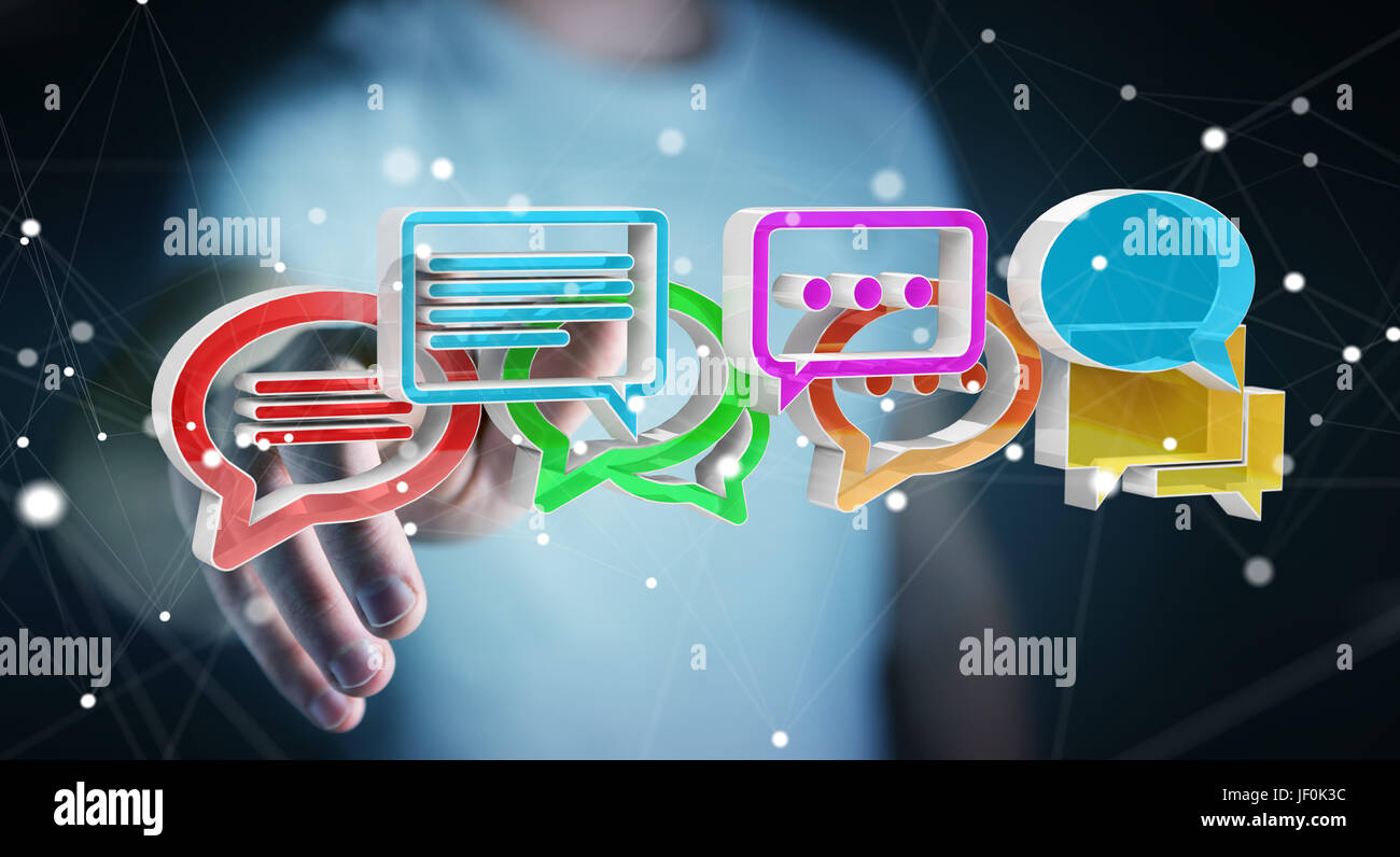 Geschäftsmann auf unscharfen Hintergrund mithilfe digitaler bunte 3D-Rendering Gespräch Symbole Stockfoto