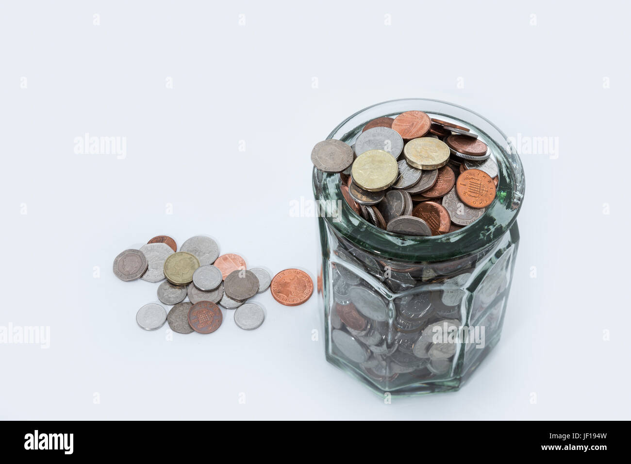 Jar-voller UK Sterling Münzen. Stockfoto