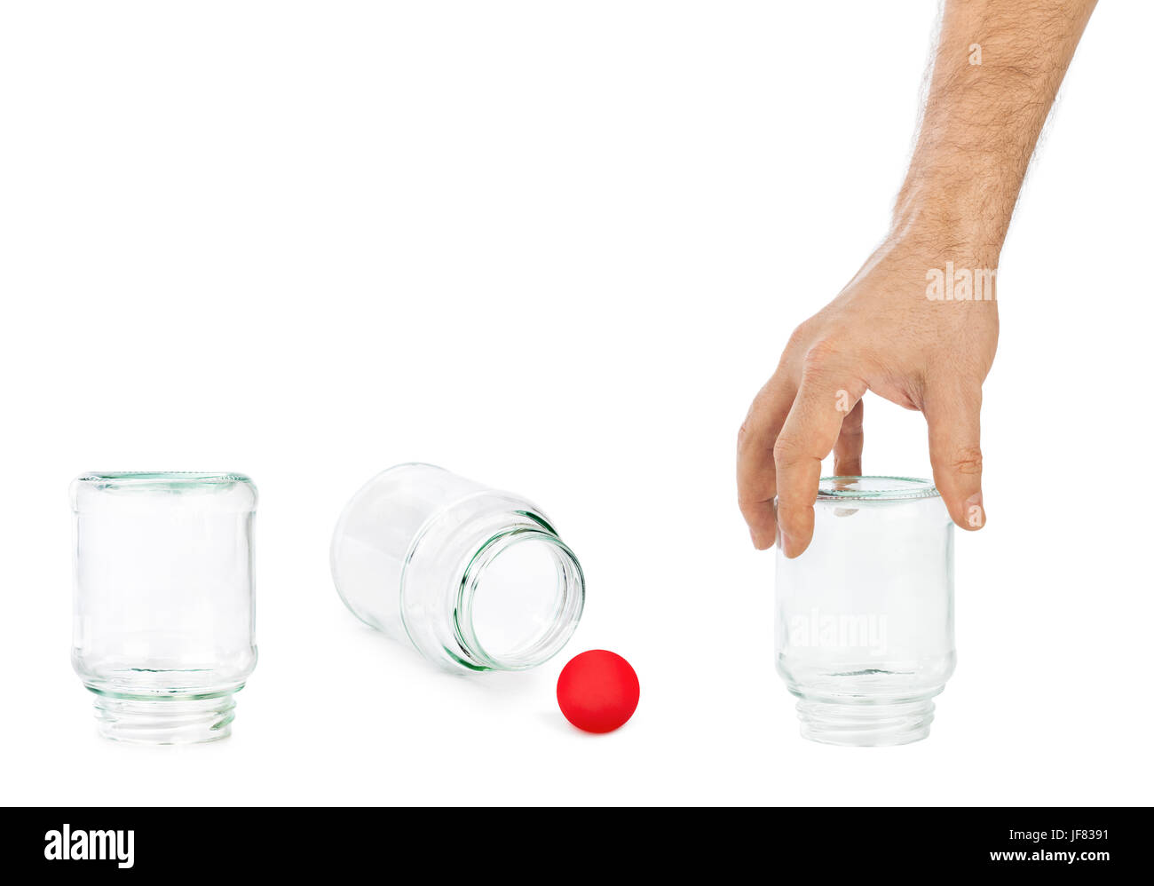 Hand und Hütchenspiel mit Glas Dosen Stockfoto