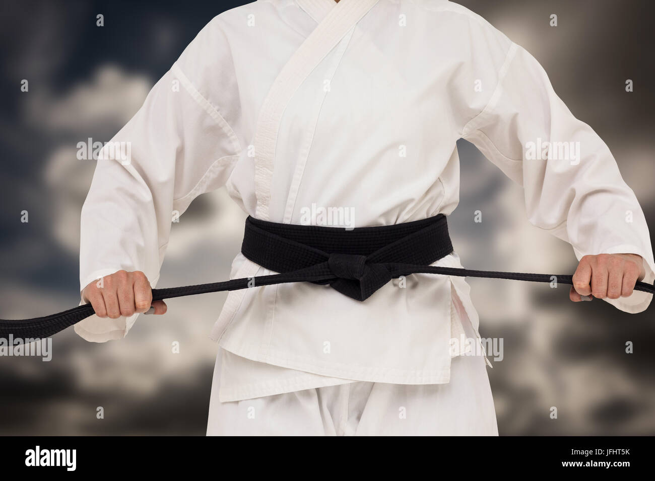 Das zusammengesetzte Bild im Fighter Anzug Karate Gürtel Stockfoto