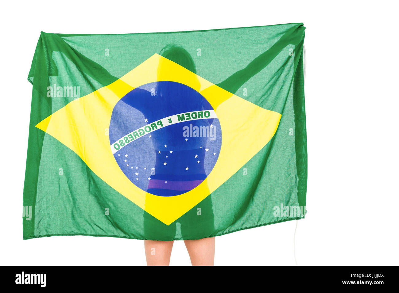 Athlet posiert mit brasilianischen Flagge nach Sieg Stockfoto