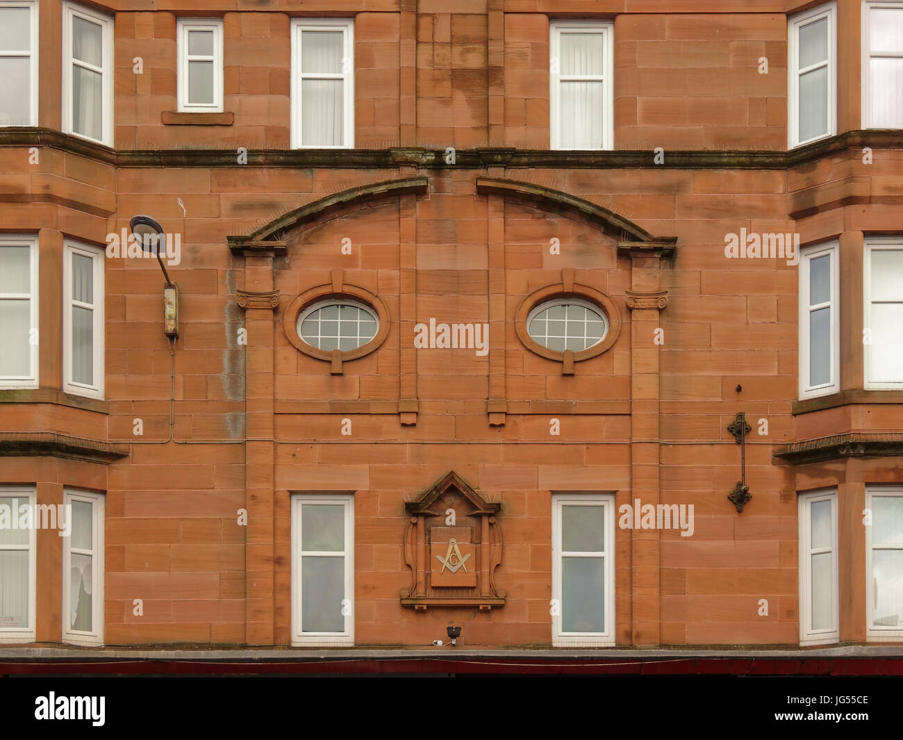 Masonic hall Dumbarton Straße in Partick, Glasgow Schottland Gebäude aus rotem Sandstein, die Maurer Symbol und sieht aus wie ein Gesicht Stockfoto