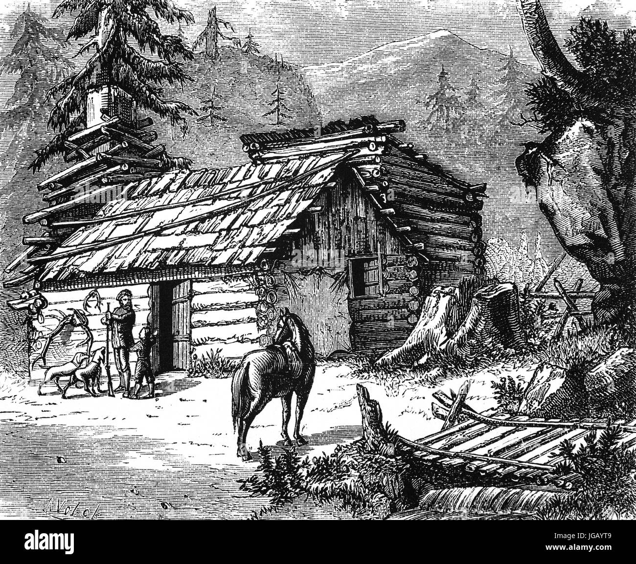 Ein Trapper mit seinen Tieren und eine Blockhütte in den Rocky Mountains, Vereinigte Staaten von Amerika Stockfoto